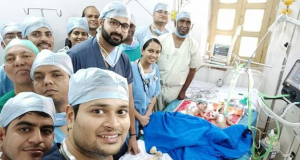 Surgeons share a celebratory selfie after successfully separating three-day-old conjoined twins in a pain-staking operation