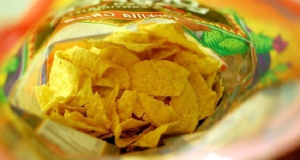 What dangerous processes in body are triggered by consumption of potato chips?