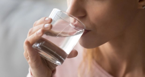 How many liters of water per day should a person drink?
